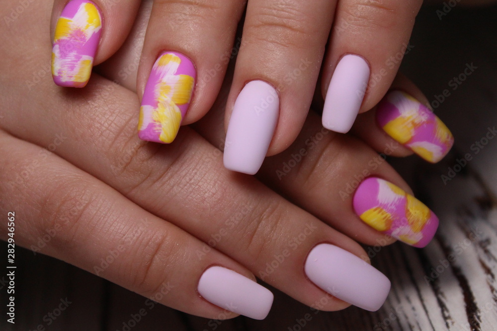 Closeup photo of a beautiful female hands with elegant manicure Closeup photo of a beautiful female hands with elegant manicure