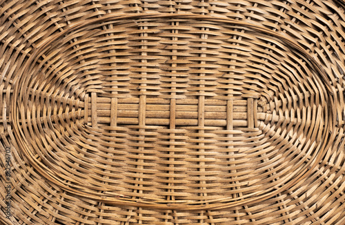 The bottom of the wicker basket of willow twigs light brown