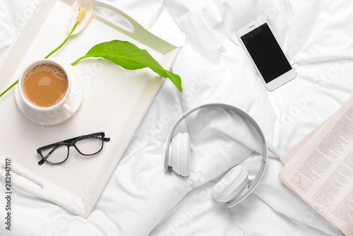 Modern headphones, cup of c...