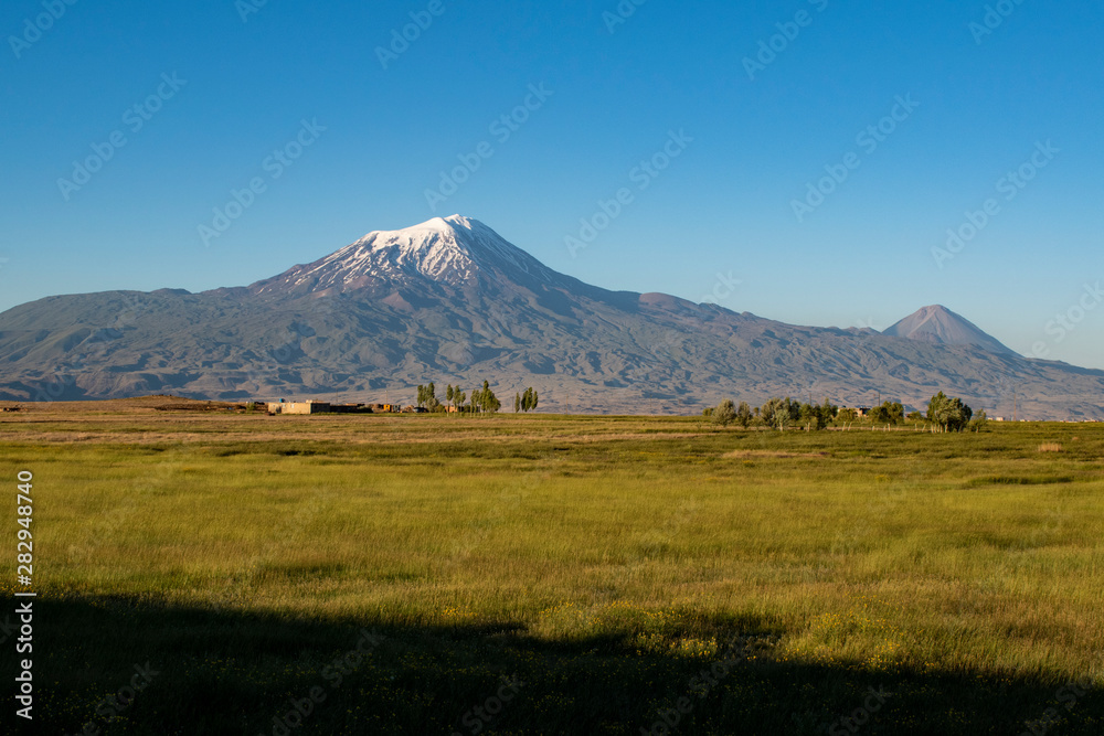 Breathtaking view of Mount Ararat, Agri Dagi, the highest mountain in the extreme east of Turkey accepted in Christianity as the resting place of Noah's Ark, a snow-capped and dormant compound volcano Breathtaking view of Mount Ararat, Agri Dagi, the highest mountain in the extreme east of Turkey accepted in Christianity as the resting place of Noah's Ark, a snow-capped and dormant compound volcano