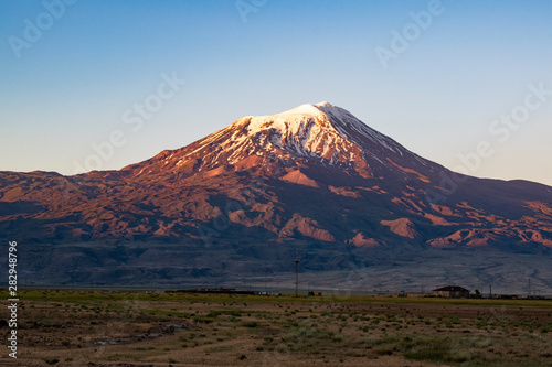 Breathtaking sunset on Mount Ararat, Agri Dagi, the highest mountain in the extreme east of Turkey accepted in Christianity as the resting place of Noah's Ark, snow-capped and dormant compound volcano © Naeblys