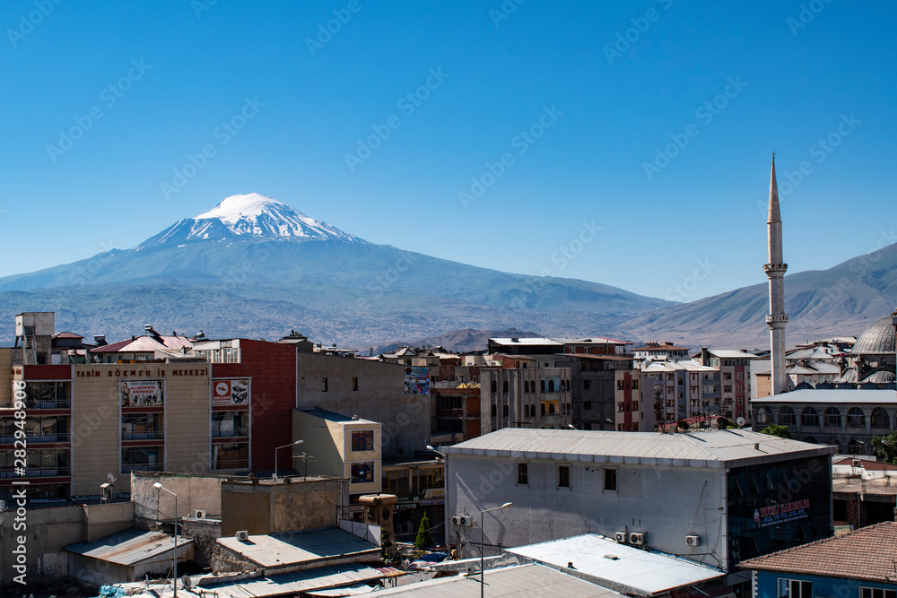 Turkey: skyline of Igdir with view of Mount Ararat, Agri Dagi, the highest mountain in the east of Turkey, the resting place of Noah's Ark for Christianity, snow-capped and dormant volcano