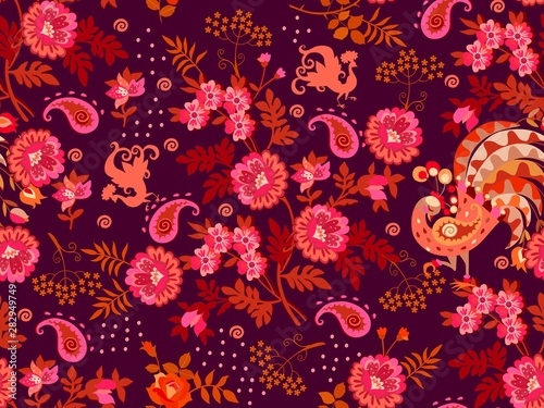 Seamless natural pattern with bouquets of vintage flowers, paisley and silhouettes of fabulous peacocks on dark purple background. Bright ethnic pattern in warm tones.