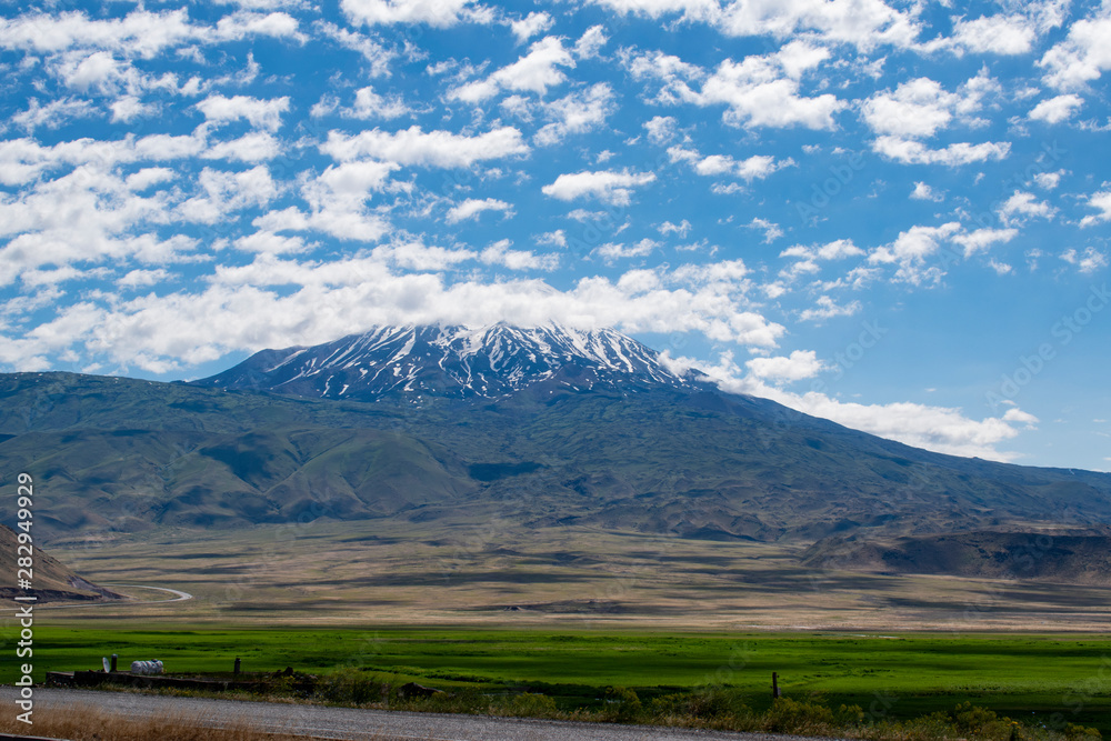 Road from Igdir to Dogubayazıt: Mount Ararat, Agri Dagi, the highest mountain in the extreme east of Turkey, the resting place of Noah's Ark for Christianity, snow-capped and dormant compound volcano