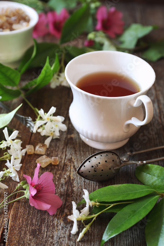 Decorative composition of vintage style: romantic tea drinking with jasmine tea