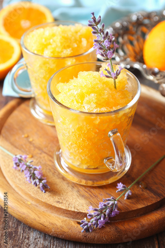 Orange granita, frozen summer dessert and blooming lavender