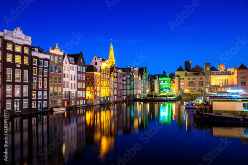 Canals and tradition house in Amsterdam at night. Amsterdam is the capital and most populous city of the Netherlands.