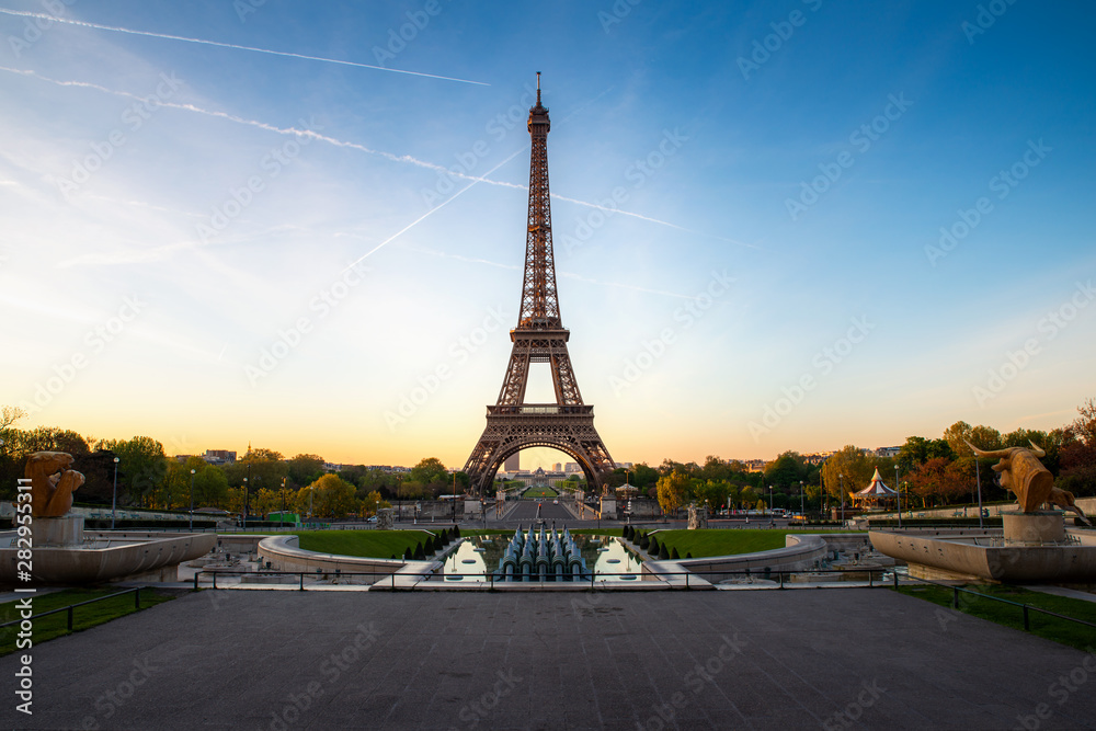 Fototapeta premium Landscape panoramic view on the Eiffel tower and park during the sunny day in Paris, France. Travel and Vacation concept..