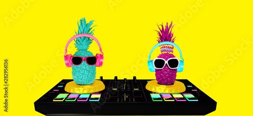  Pineapples in headphones and glasses on a dj mixer. yellow background. Concept art collage