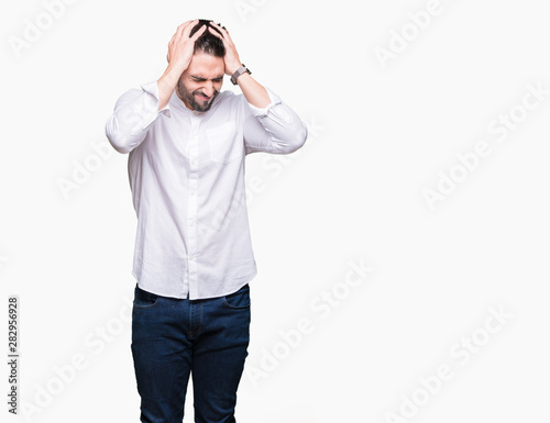 Young business man over isolated background suffering from headache desperate and stressed because pain and migraine. Hands on head.