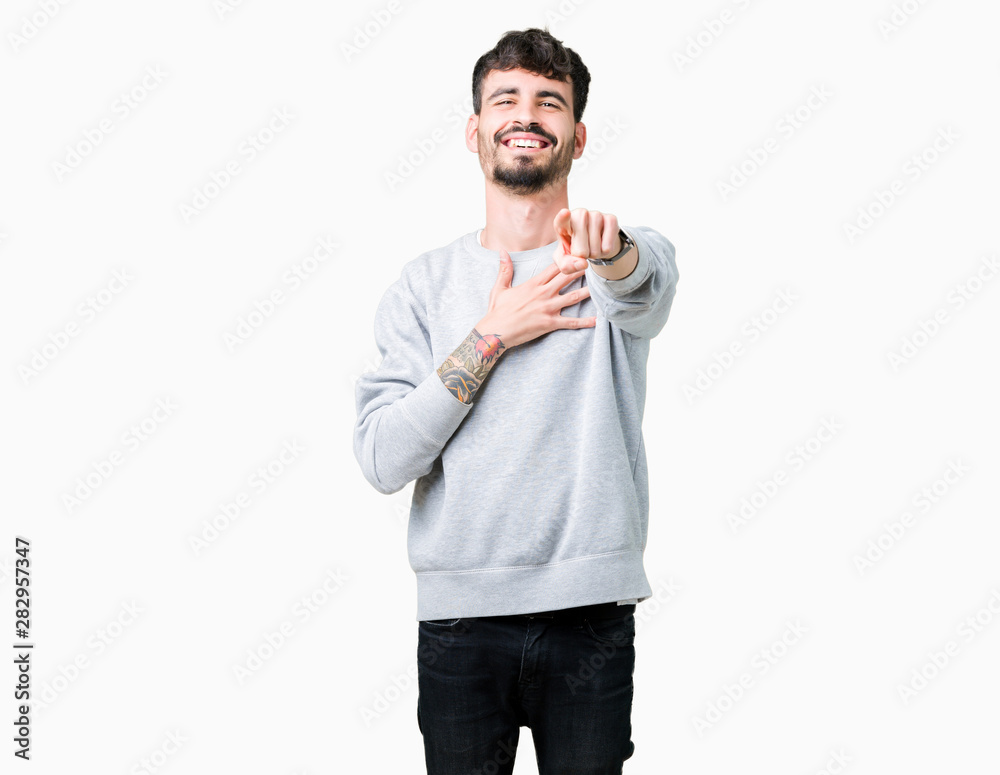 Young handsome man wearing sweatshirt over isolated background Laughing of you, pointing to the camera with finger hand over chest, shame expression Young handsome man wearing sweatshirt over isolated background Laughing of you, pointing to the camera with finger hand over chest, shame expression