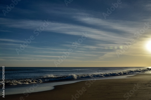 sunset landscape on the beach with bokeh lights