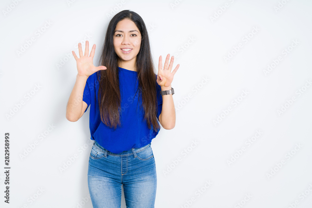 Beautiful brunette woman over isolated background showing and pointing up with fingers number nine while smiling confident and happy. Beautiful brunette woman over isolated background showing and pointing up with fingers number nine while smiling confident and happy.