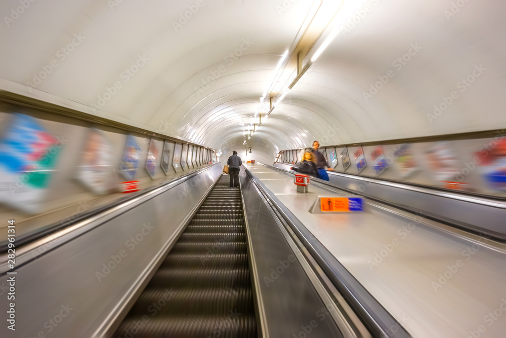 London, UK - May 16 2018: Unidentified people use escalator at King's Cross Station