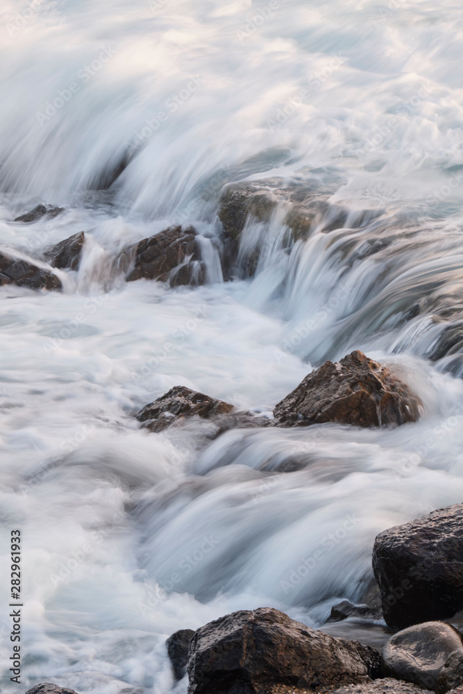 Water flow motion over rocks during big swell in Australia Water flow motion over rocks during big swell in Australia