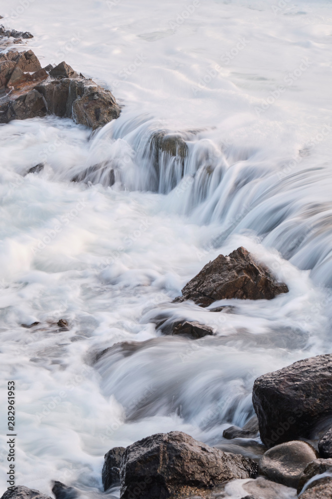 Water flow motion over rocks during big swell in Australia Water flow motion over rocks during big swell in Australia