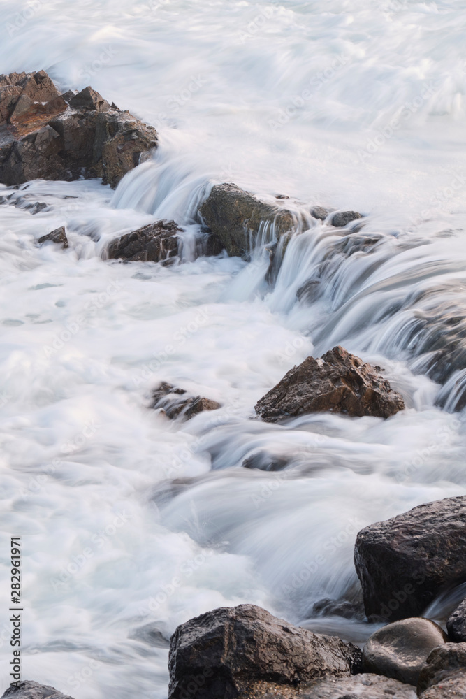Water flow motion over rocks during big swell in Australia Water flow motion over rocks during big swell in Australia