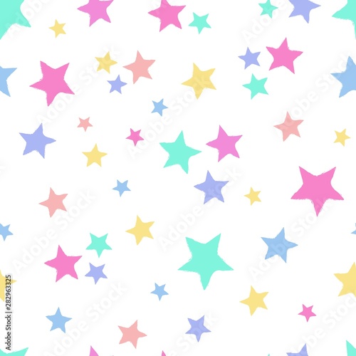 Seamless repeat pattern with tossed colorful pastel stars on a white background
