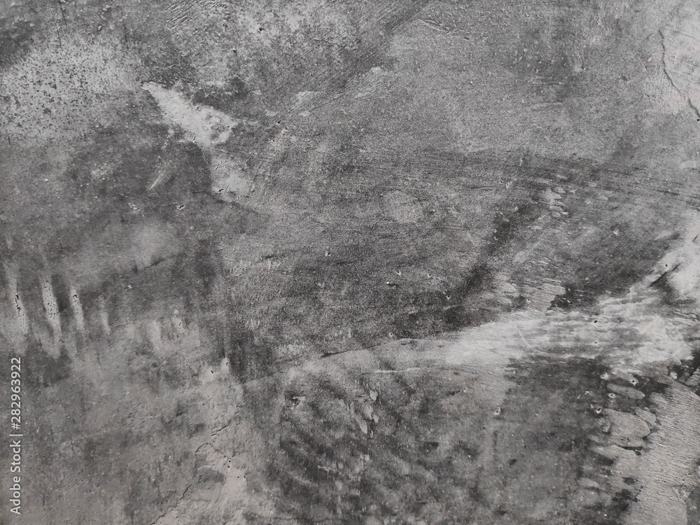 Fototapeta premium The background is a shiny cement floor with cracks.