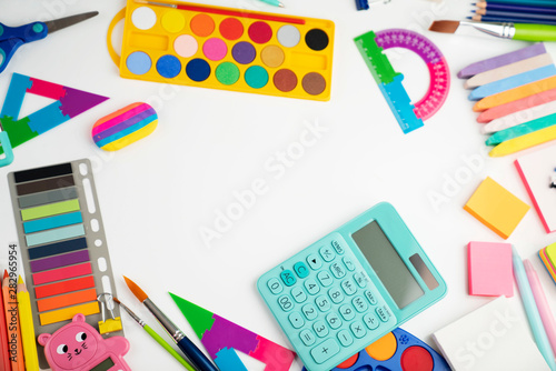 School supplies. Set of colorful school accessories isolated on the white table.