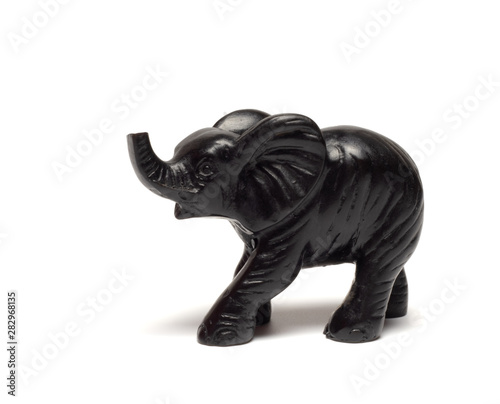  black elephant figurine on a white background © Stanislav