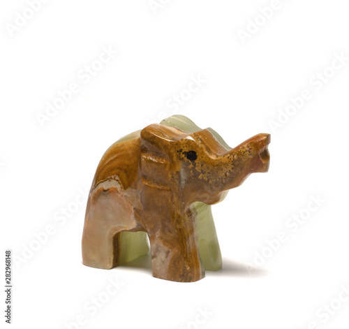 figurine of an elephant from malachite on a white background
