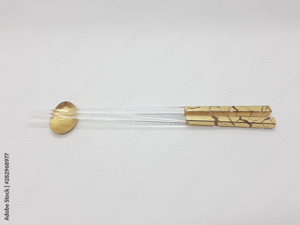 Japanese Elegant Luxury Modern Classic Golden Transparent Chopstick in White Isolated Background Japanese Elegant Luxury Modern Classic Golden Transparent Chopstick in White Isolated Background