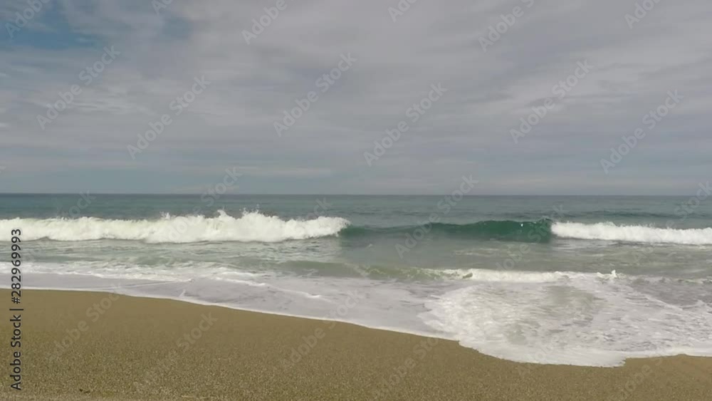 Waves arriving at the beach in slow motion Waves arriving at the beach in slow motion