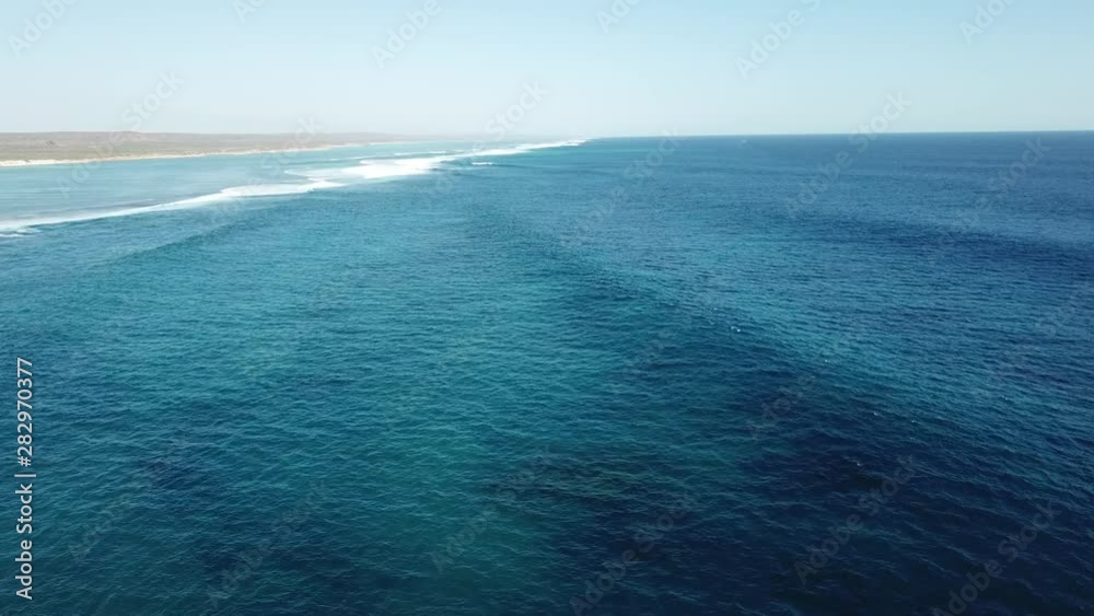 Aerial shot of ocean waves and coastline on the Ningaloo Reef, Australia Aerial shot of ocean waves and coastline on the Ningaloo Reef, Australia