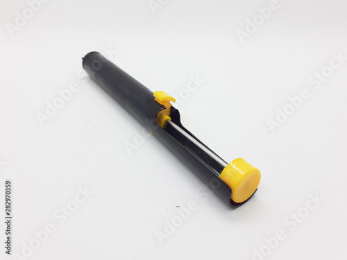 Black Yellow Colored Hand Solder Tin Extractor for Electronic Circuit Fix in White Isolated Background