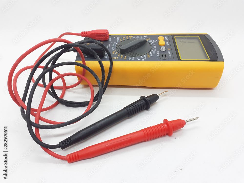 Yellow Modern Digital Electronic Multi Meter with Ohm Ampere Volt and Watt Measurement with Red and Black Probe in White Isolated Background Yellow Modern Digital Electronic Multi Meter with Ohm Ampere Volt and Watt Measurement with Red and Black Probe in White Isolated Background