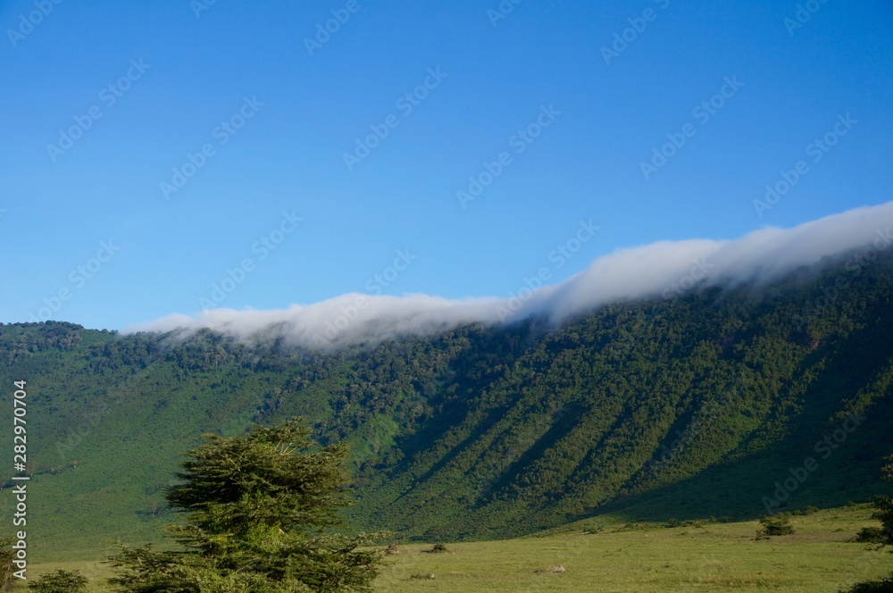 Clouds coming over the ridge of the Ngorongoro crater