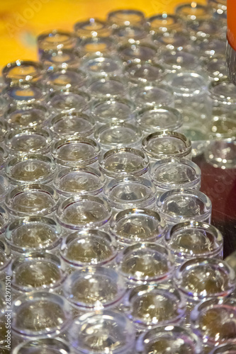 Many glasses with orange juice on buffet table