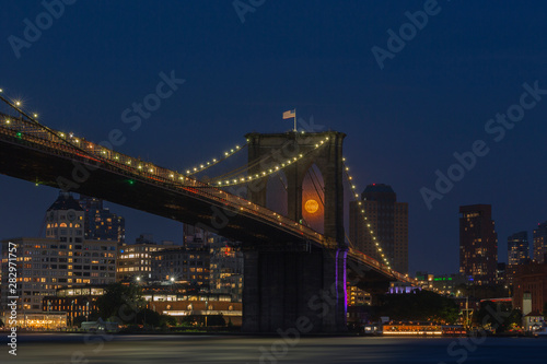 Fototapeta Naklejka Na Ścianę i Meble -  Full moon rise from Brooklyn bridge at sunset