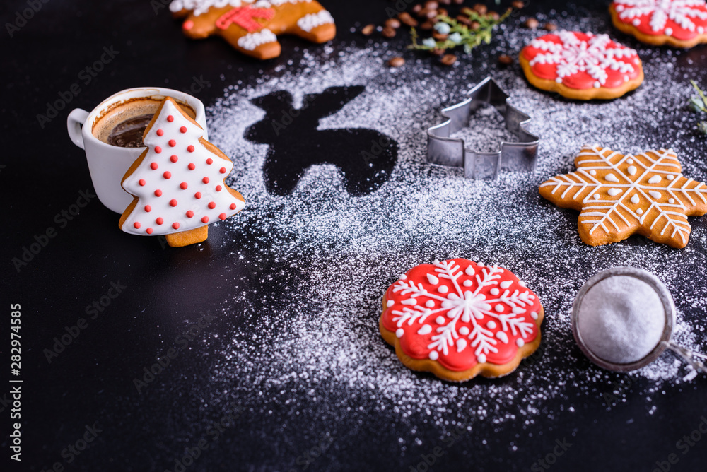 Christmas homemade gingerbread cookies on a dark background Christmas homemade gingerbread cookies on a dark background