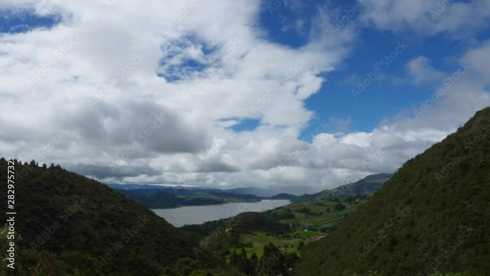 Time lapse clouds mountains and lake in Guatavita Cundinamarca Colombia, two mountains between the lake. Time lapse clouds mountains and lake in Guatavita Cundinamarca Colombia, two mountains between the lake.