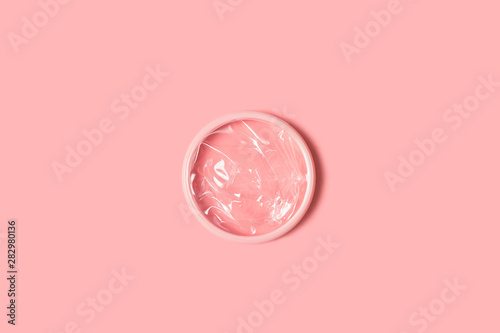 Menstrual disc isolated on pink background photo