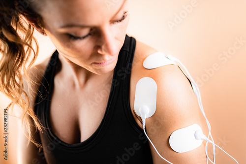 Bild auf Leinwand Shoulder Physical Therapy with TENS Electrode Pads, Transcutaneous Electrical Ne