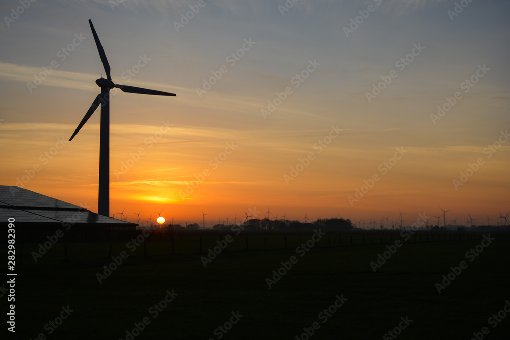 a wonderful sunrise over  windmills