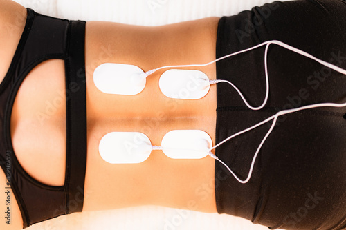 Lower Back Physical Therapy with TENS Electrode Pads, Transcutaneous Electrical Nerve Stimulation photo