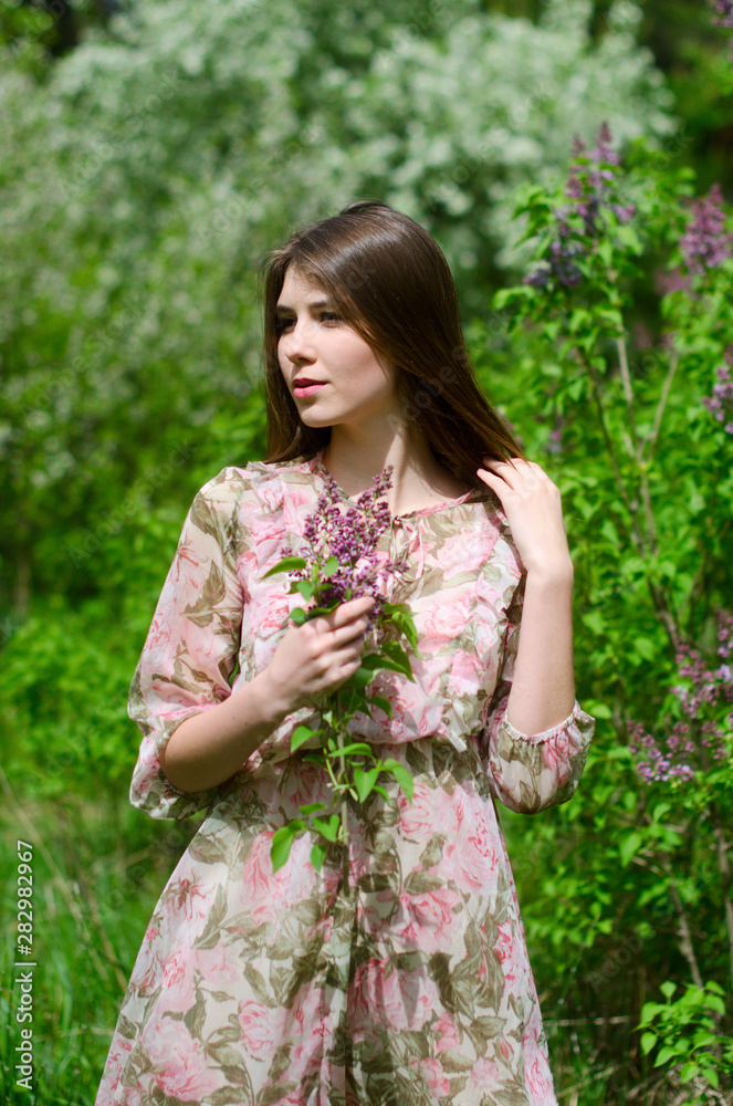 beautiful girl in a blooming Park beautiful girl in a blooming Park