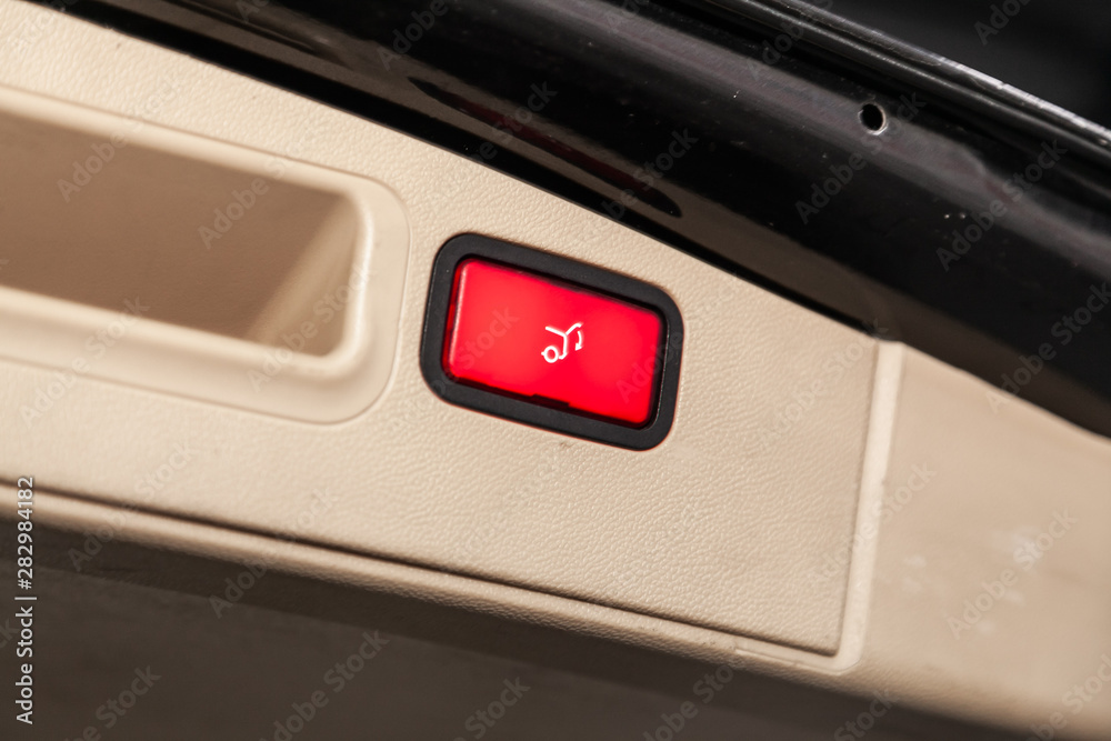 Close-up of the trunk release button. modern car interior: parts, buttons, knobs.