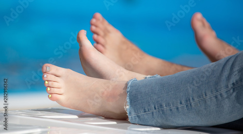 Feet girl swimming in the pool