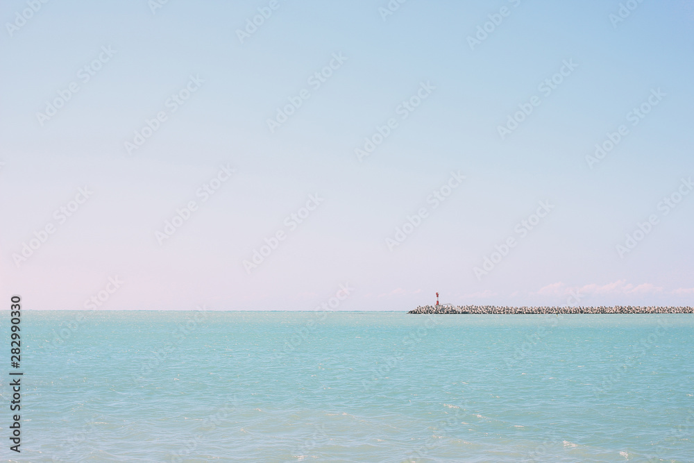 Minimal landscape of Black sea with lighthouse, Sochi, Russia, nature background
