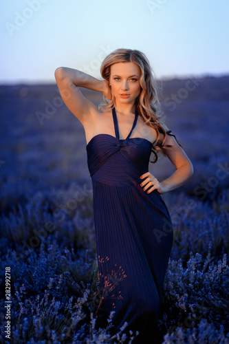 Beautiful girl on the lavender field. Beautiful woman in the lavender field on sunset. © Fototocam