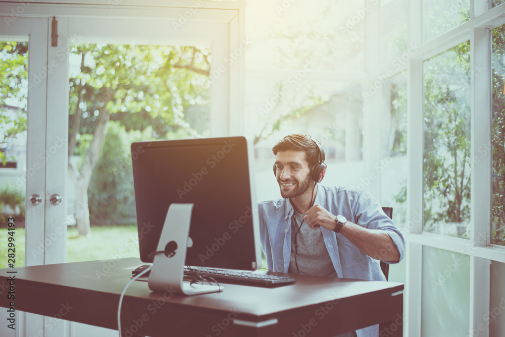 Sucessful man hands rais up with winner game online,Happy and smiling,Relax time Sucessful man hands rais up with winner game online,Happy and smiling,Relax time