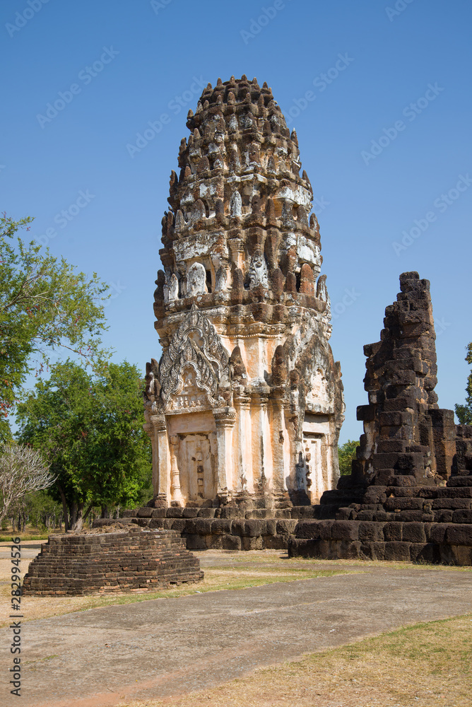 Ancient Khmer prang on the ruins of the Buddhist temple of Wat Phra Pai Luang on a sunny day. Sukhothai, Thailand