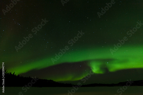 Frozen Lake Laberge Aurora borealis night sky © PiLensPhoto