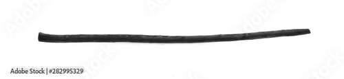 black wooden stick for walking, black magic staff on a white background