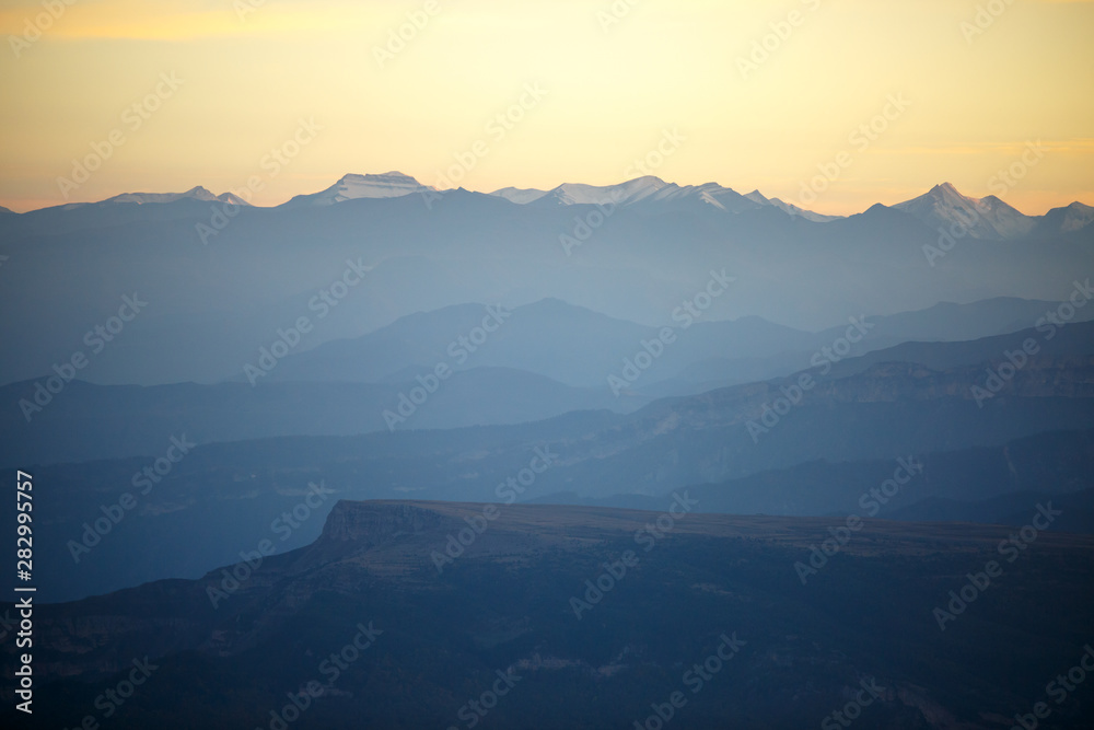 Image of evening mountain landscape with red sky